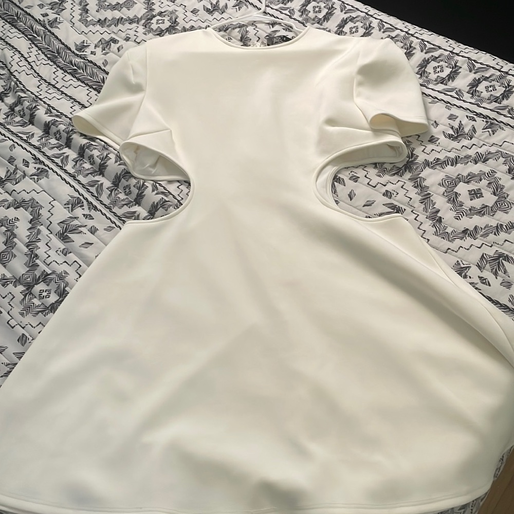 Cream skater dress with cut outs